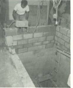 Man working on elevator shaft