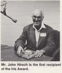 John Hirsch holding his Iris award