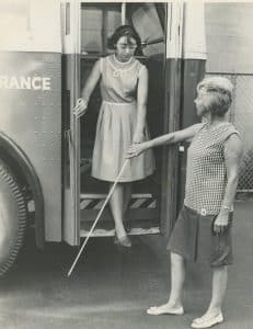 Rosalyn Snow (right) oversees Ginny Place (left) as she exits the Society’s mobility bus.